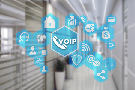 VOIP on the touch screen with a blur background of the office.The concept of Voice over Internet Protocolの写真素材