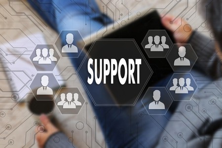 SUPPORT on the touch screen with a blur the girl with the gadget, background .The concept Internet of  SUPPORTの写真素材