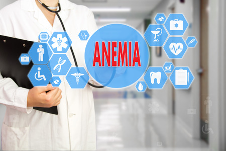 Medical Doctor with stethoscope and word ANEMIA, aplastic anemia  in Medical network connection on the virtual screen on hospital background.Technology and medicine concept.の写真素材