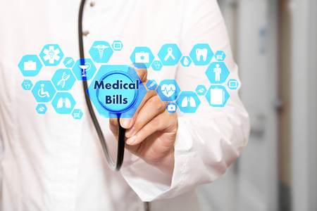 Medical Bills on the touch screen with icons on the medicine background blur Doctor in hospital.の写真素材