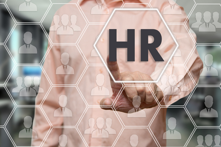 Businessman chooses HR, Human Resources on the touch screen network connections. The concept of finding talented staff in the right fieldの写真素材