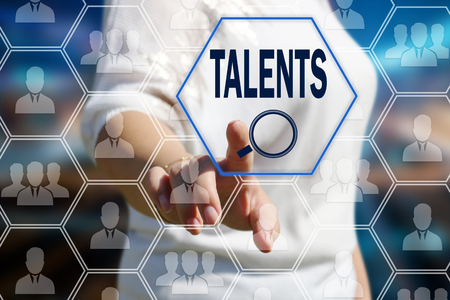 The businessman pulled the search for qualified specialists in the field of the newest technologies on the touch screen with a futuristic background.の写真素材