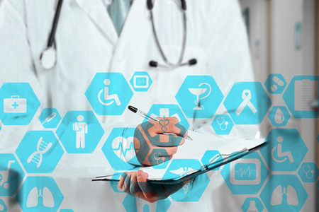 Medical network connection on the virtual touch screen and Doctor with stethoscope in hospital background.Technology and medicine concept.の写真素材