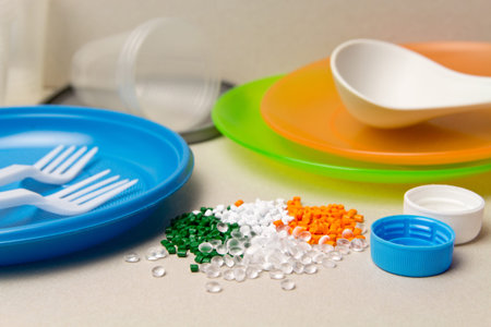 Plastic disposable tableware and Plastic Raw material. Colored granules of polyethylene,...
