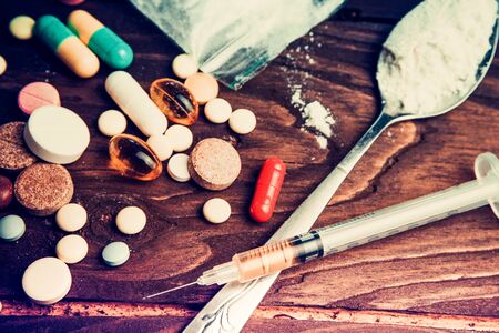 Drug concept. Use illicit Drug abuse .Addiction heroin.Injection, doping. Opium epidemic. Toning, selective focus.の写真素材