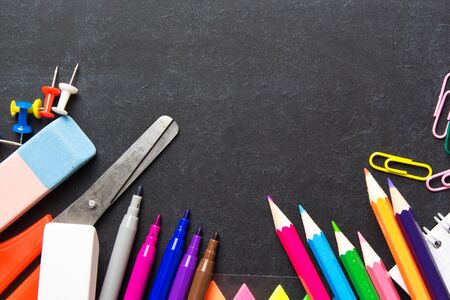 School supplies on blackboard background . The concept of education, study, learning, elearning. Back to schoolの写真素材