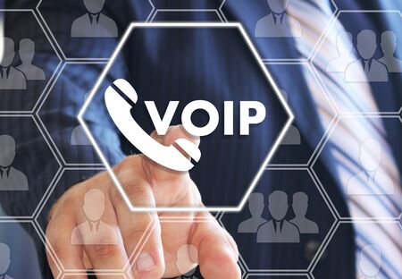 The businessman chooses VOIP on the virtual screen in social network connection. の写真素材
