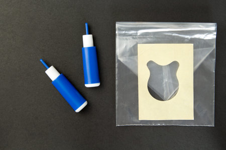 Lancet for collecting blood, Pediatric urine bag for  on background. Take a blood and urine test....