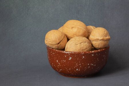 walnut in a beautiful bowl on the backgroundの写真素材