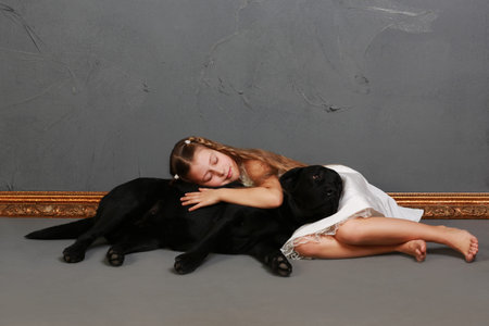 Little girl and dog in the studio (photoshoot)