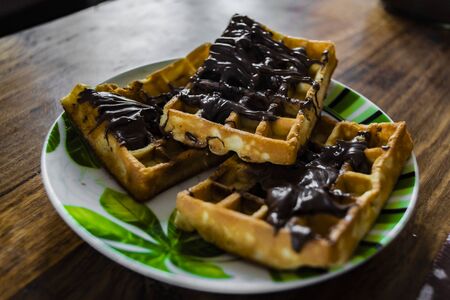 Thai waffles with chocolate on a plateの写真素材