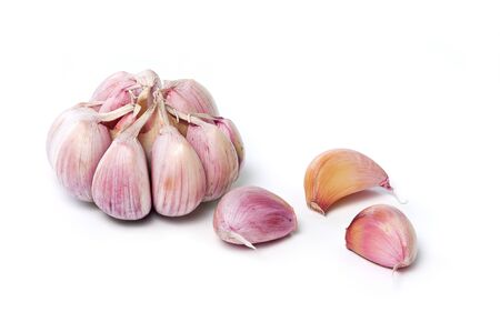Garlic bulb and garlic cloves isolated on white background. Fresh garlic closeup.の写真素材
