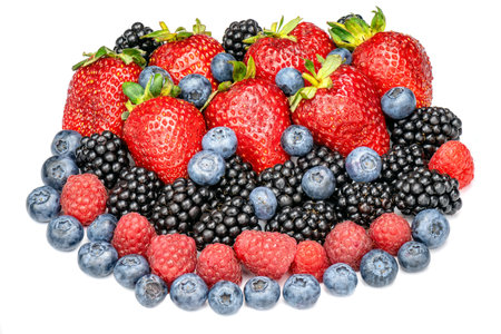 Fresh berries strawberries, raspberries, blackberries and blueberries isolated on white background. Heap of different berries top view.の写真素材