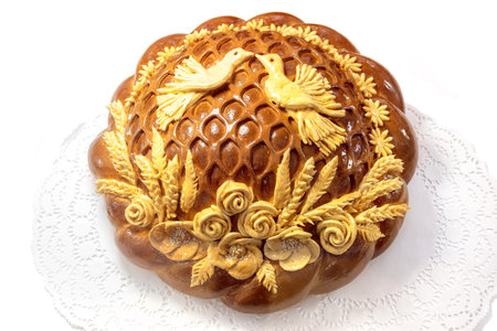 Traditional Russian wedding round loaf isolated on white background top view.の写真素材