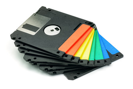 Stack of colored floppy diskettes top view isolated on white background.の写真素材