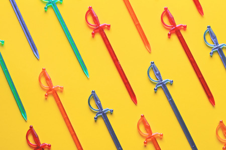 Flat lay set: skewers canapes on pastel backgrounds. Multi-colored sticks for a canape on a yellow background, top view. Colorful skewers for canape or snacks. Trendy colorful photo. Minimal style with colorful paper backdrop.の写真素材
