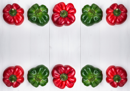 Fresh sweet peppers, bell peppers or capsicum on wooden background. Top view and copy spaceの写真素材