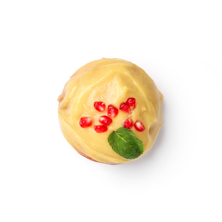 Donut glazed with honey and pomegranate. Top view.  Isolated image.の写真素材