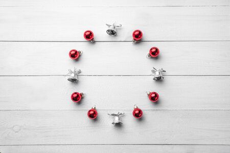 Christmas winter wreath, round frame . Christmas tree decorations and on white wooden background. Wallpaper, background or holiday art. Top view, place for text, flat lay. Xmas and happy new yearの写真素材