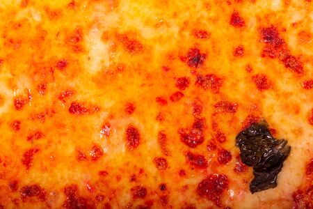 Traditional tasty pizza with mozzarella, bocconcini and basil leaf or pizza margherita, close up view. Pizza background, macro photographyの写真素材