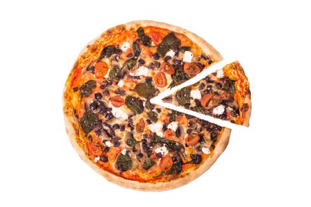 Italian pizza with mozzarella, feta, cherry tomatoes, spinach, mushrooms and kalamata olive, with a slice removed isolated on white background, top viewの写真素材