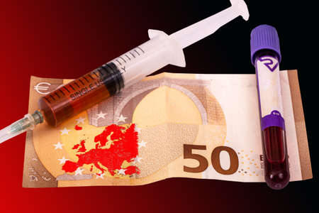 Business of medicine, price to create immunization against Coronavirus or Covid-19. Euro banknote, blood test with space for text on the label and vaccineの写真素材