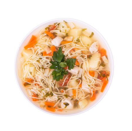 Plate of delicious chicken soup with noodles, isolated on white background, top viewの写真素材