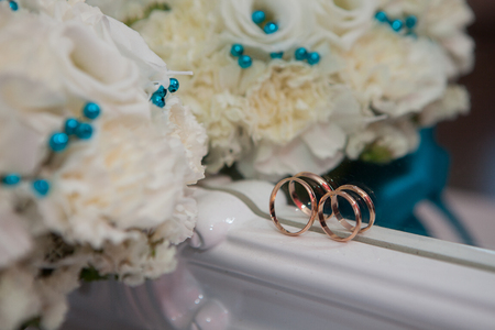Beautiful wedding bouquet in the hands of the brideの写真素材