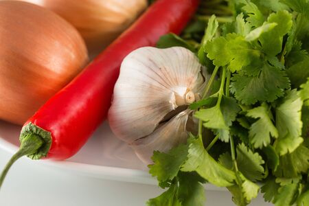 Vegetable - tomato, bow, pepper isolated on white backgroundの写真素材
