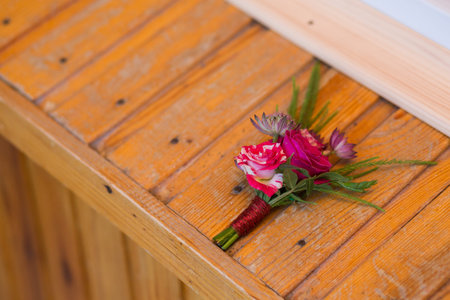 Beautiful wedding boutonniere of varios flowers on nice background