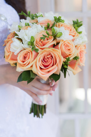 wedding bouquet in hands of the brideの写真素材