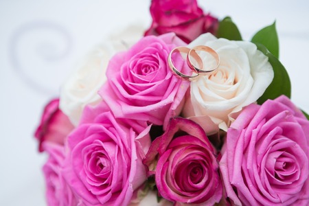 Two wedding rings and spring blossoms. Wedding concept.の写真素材