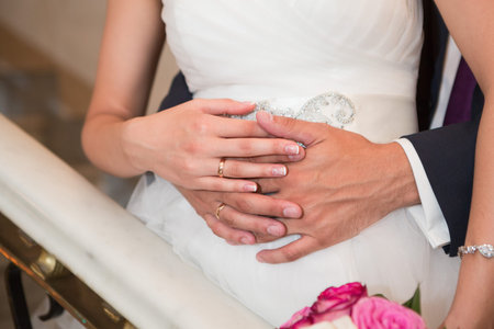Bride and groom holding there hands outdoors