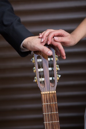 wedding gold rings on guitar. wedding conceptの写真素材