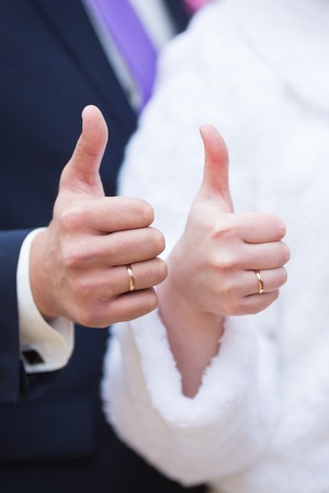 Bride and groom holding there hands outdoorsの写真素材