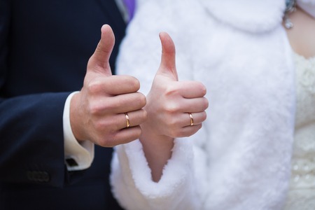 Bride and groom holding there hands outdoorsの写真素材