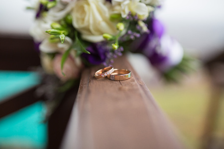 Two wedding rings and spring blossoms. Wedding concept.の写真素材