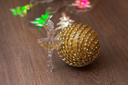 golden christmas ball at the rustic backgroundの写真素材