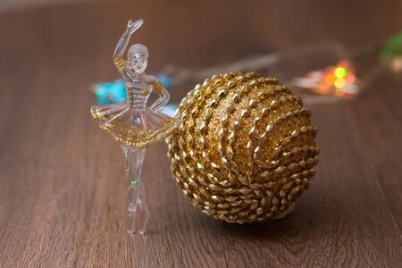 golden christmas ball at the rustic backgroundの写真素材
