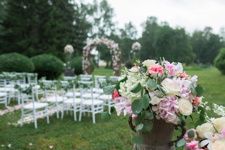 beautiful wedding ceremony in the park in the rainの写真素材