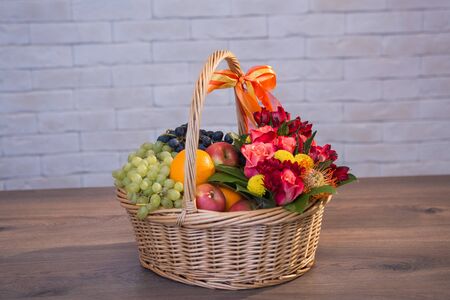 Beautiful flower bouquets on a light background of a brickの写真素材