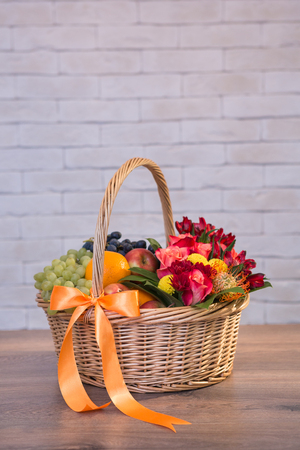 Beautiful flower bouquets on a light background of a brickの写真素材