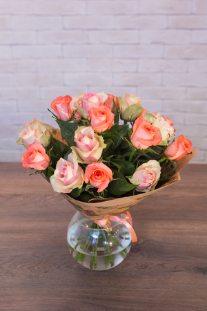 Beautiful flower bouquets on a light background of a brickの写真素材