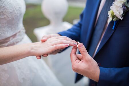 Beautiful wedding bouquet in hands of the brideの写真素材