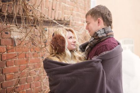 Happy Young Couple in Winter Park having fun.Family Outdoors. loveの写真素材