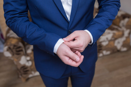 Boutonniere on hip trendy groom at wedding
