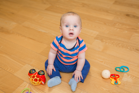 baby boy playing with his toys indoors at homeの写真素材