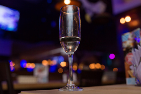 wine glass with light bokeh in backgroundの写真素材