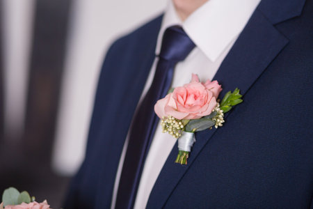 Boutonniere on hip trendy groom at wedding
