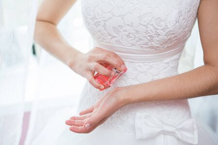Wedding veil, perfume bottle and a garterの写真素材
